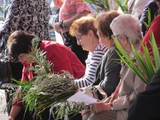 Parishioners with palm and olive branches on Palm Sunday